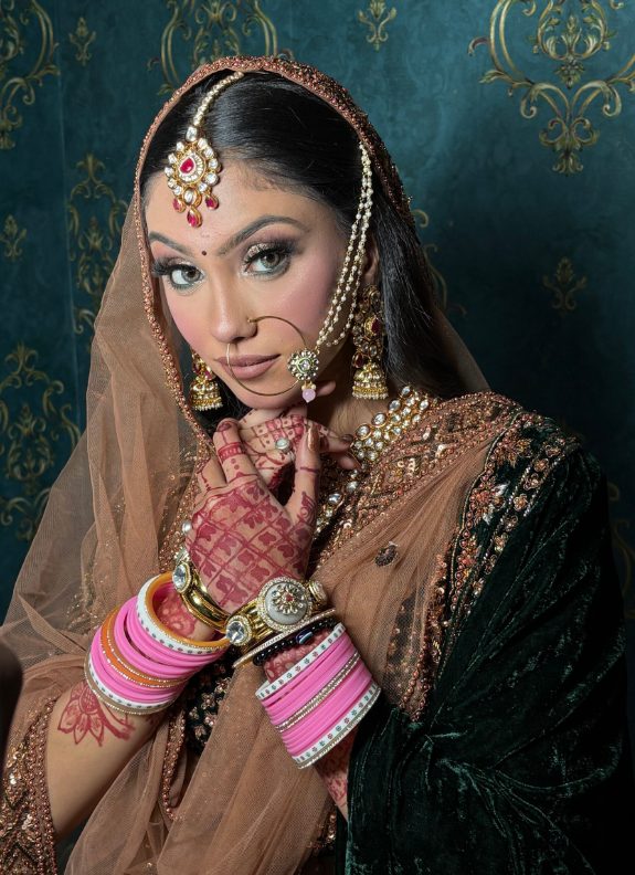 Bridal makeup with kundan jewellery and nath by Radhika Arora, Gurugram